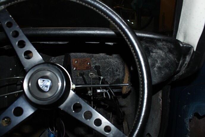 inside car looking through steering wheel.JPG